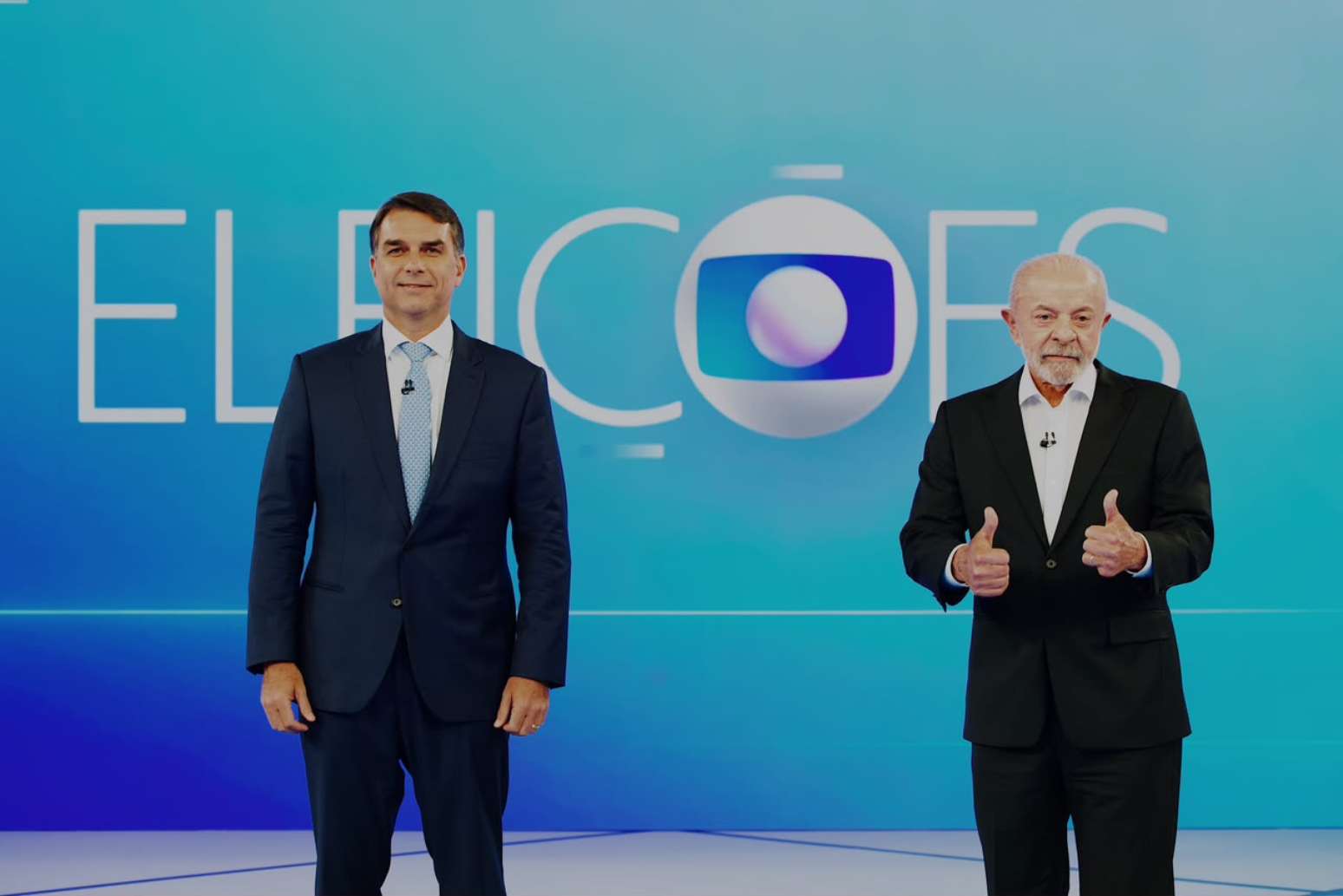 Flávio Bolsonaro e Lula durante debate da Globo